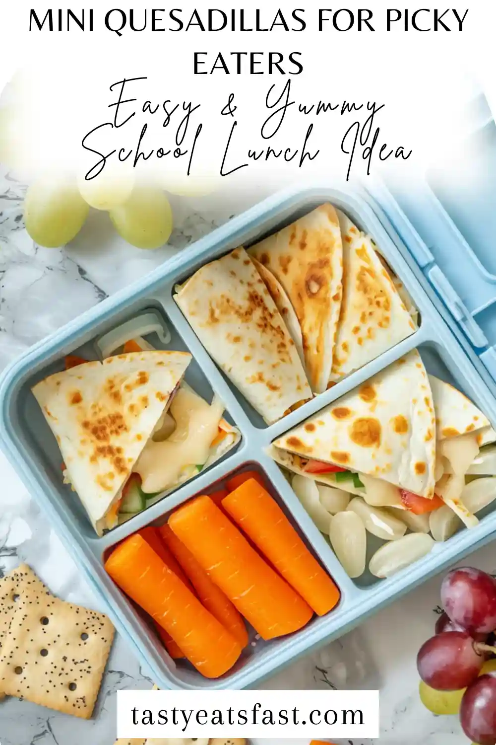 Cheesy mini quesadillas cut into wedges, packed in a kids lunchbox with fruit and veggies.